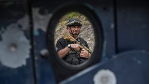 A policeman with a Kosovo special unit stands guard in Banjska, north Kosovo, after tensions flared between Serbians and Kosovans. Photo: Armend Nimani/AFP/Getty