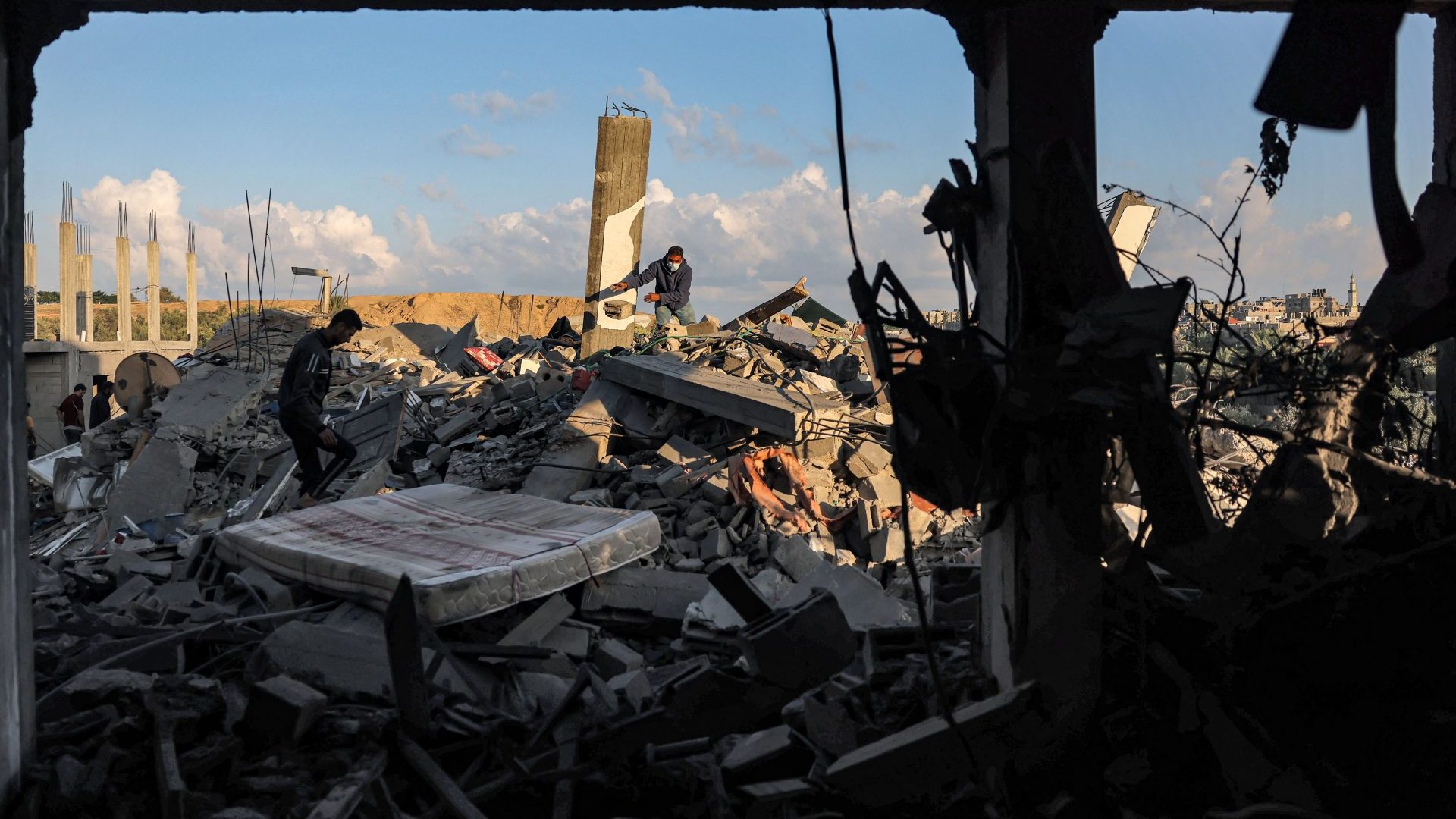 People search through the rubble of a destroyed building following Israeli bombardment in Rafah in the southern of Gaza Strip. Photo: MOHAMMED ABED/AFP via Getty Images