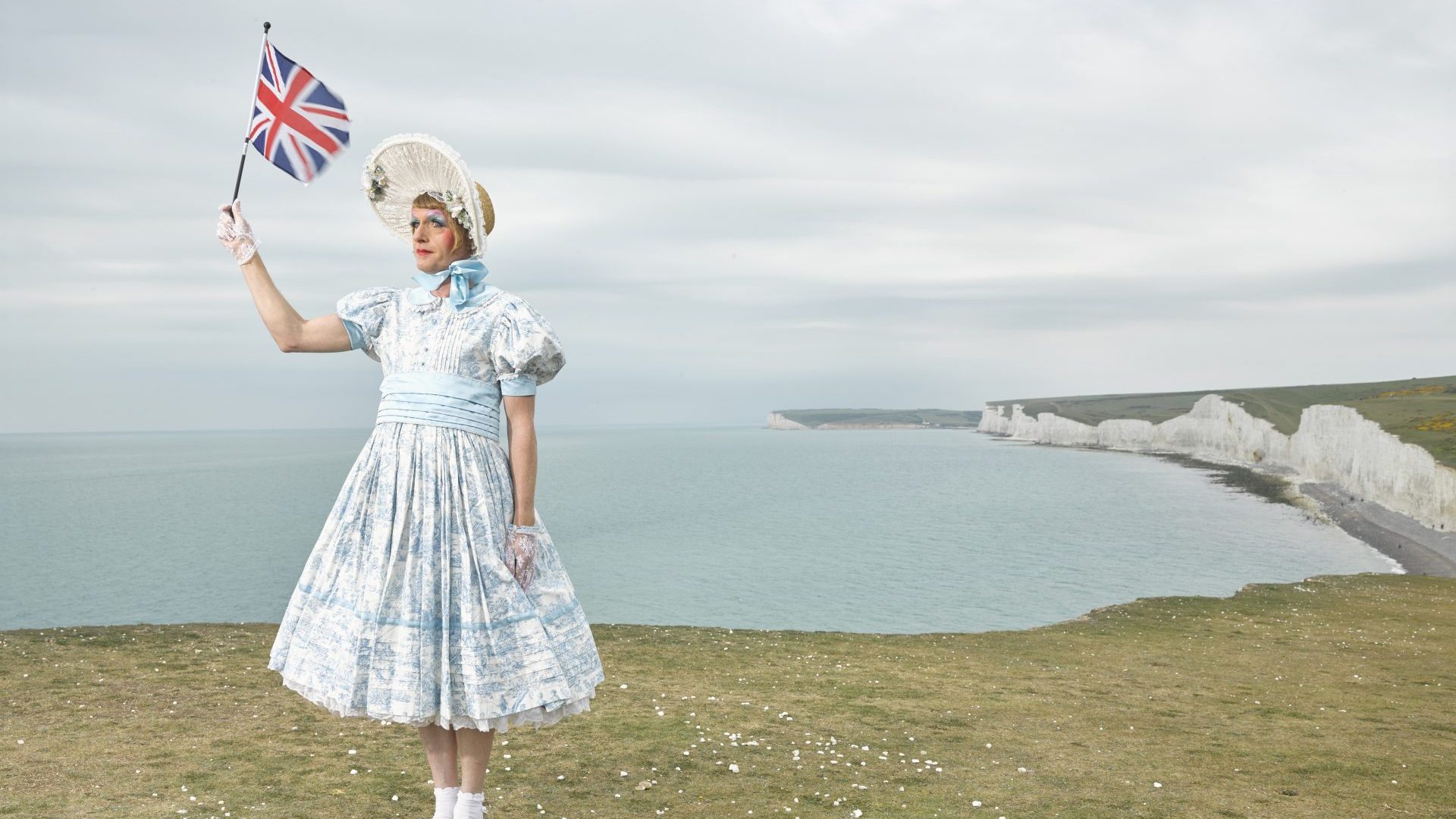 Richard Ansett’s iconic picture of Grayson Perry at Beachy Head, which the photographer imagined as “an ambivalent extended metaphor for Brexit that represents an idealised sense of Britishness conjured by the white cliffs and the suicidal ideation of the cliff edge”. Photo: Richard Ansett