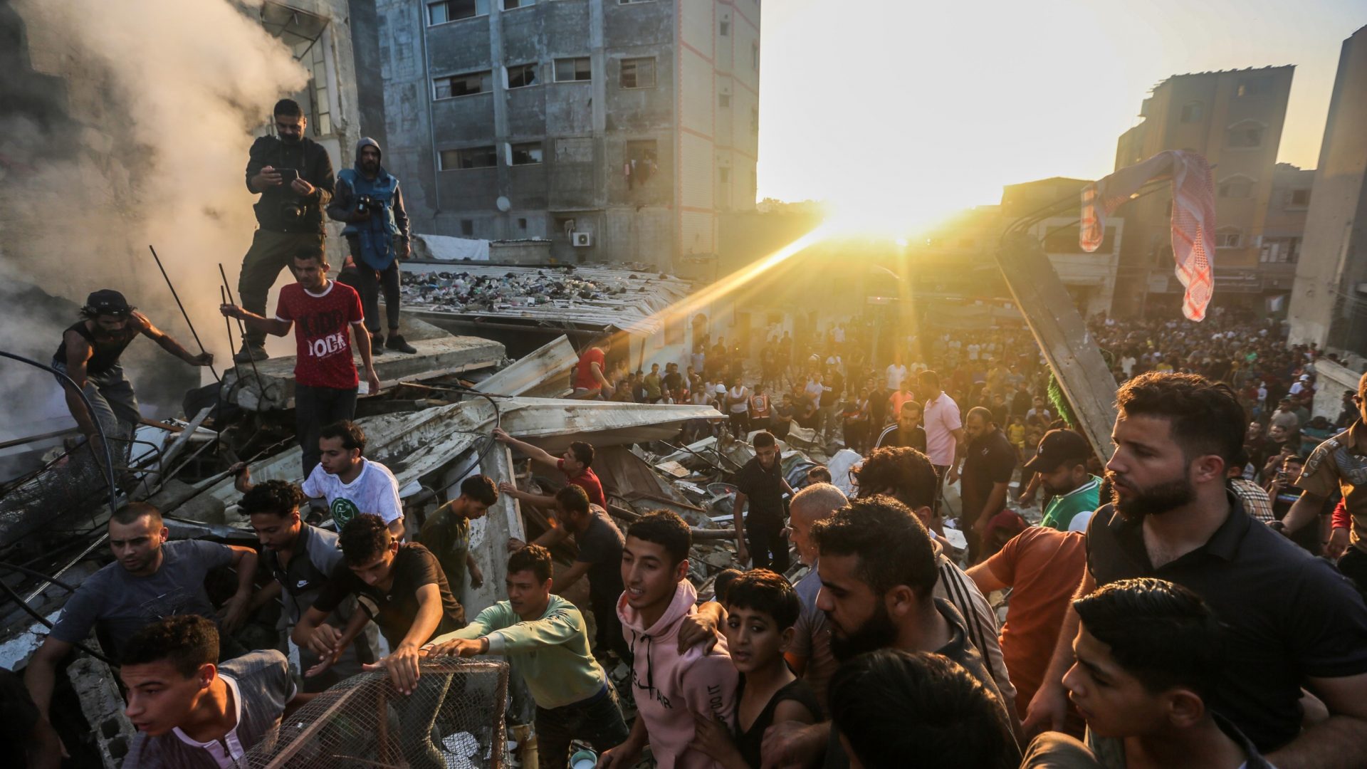 People in Khan Yunis search for survivors of bombardment in the southern Gaza Strip, November 4. Photo: Ahmad Hasaballah/Getty 

