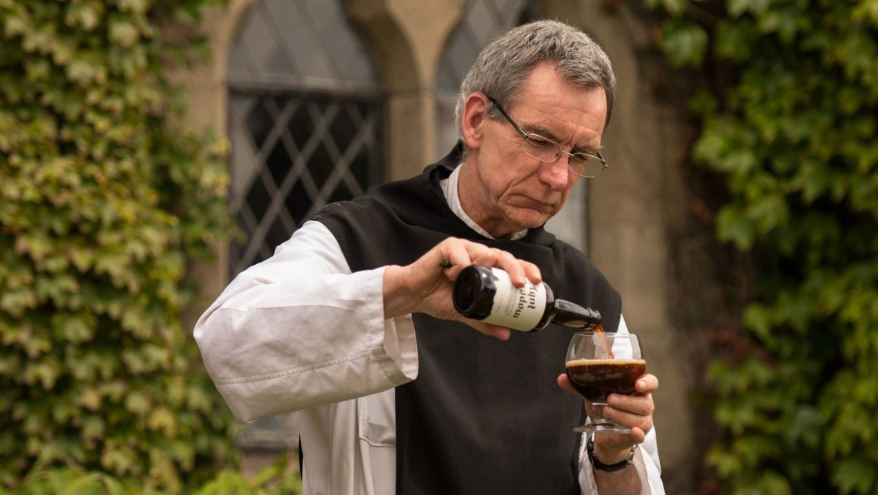 Father Joseph pours a bottle of Tynt Meadow English Trappist ale at Mount Saint Bernard Abbey near Coalville. Photo: Oli Scarff/AFP/Getty
