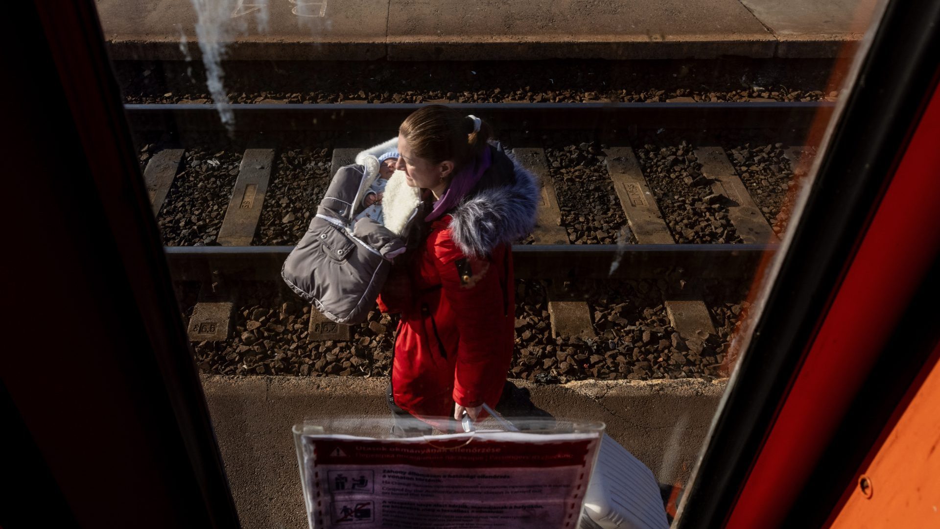 Refugees arrive to the train station as they flee Ukraine for Zahony, Hungary. Photo: Janos Kummer/Getty Images