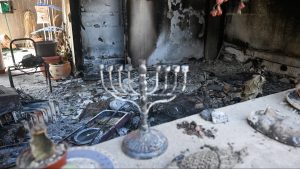 A Hanukkah menorah remains in a ruined house after Hamas’s attack on the Kissufim kibbutz near the border with Gaza. Photo: Alexi J Rosenfeld/Getty
