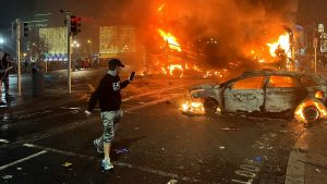 Vehicles burn in Dublin after protesters gathered in the city following the stabbings earlier in the day. Photo: Peter Murphy/AFP/Getty