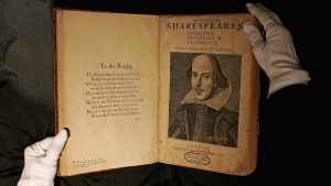 A Sotheby’s employee handles a copy of the most important book in English literature, William Shakespeare’s First Folio from 1623, prior to its sale at auction in 2006. Photo: Scott Barbour/Getty