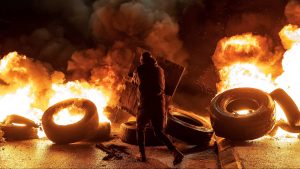 Tyres burn in the occupied West Bank on November 27, ahead of an expected release of Palestinian prisoners in exchange for Israeli hostages held by Hamas. Photo: Fadel Senna/AFP/Getty