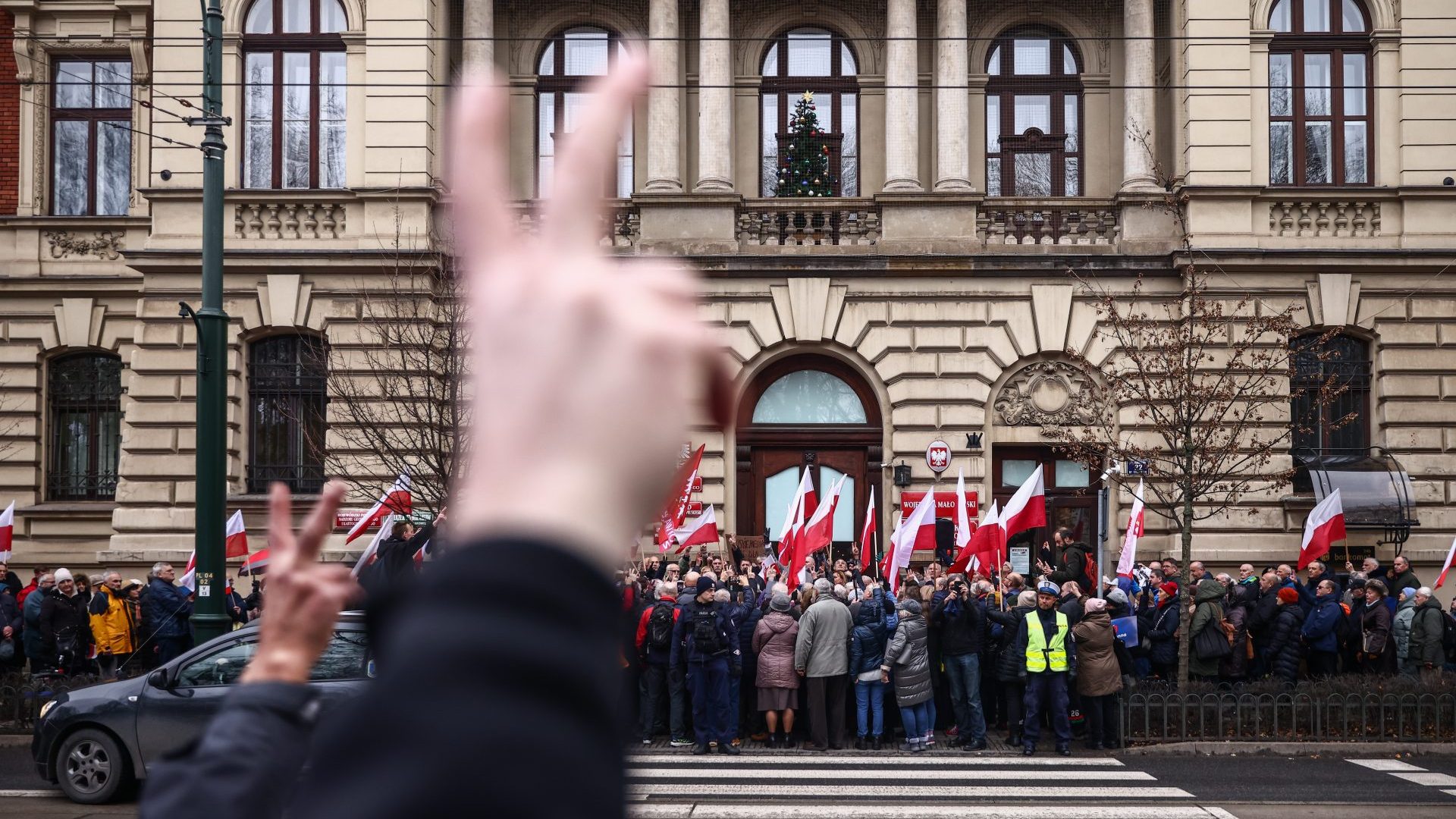 People protest against changes in publicly-owned media in front of the Provincial Office in Krakow, Poland (Photo by Beata Zawrzel/NurPhoto via Getty Images)