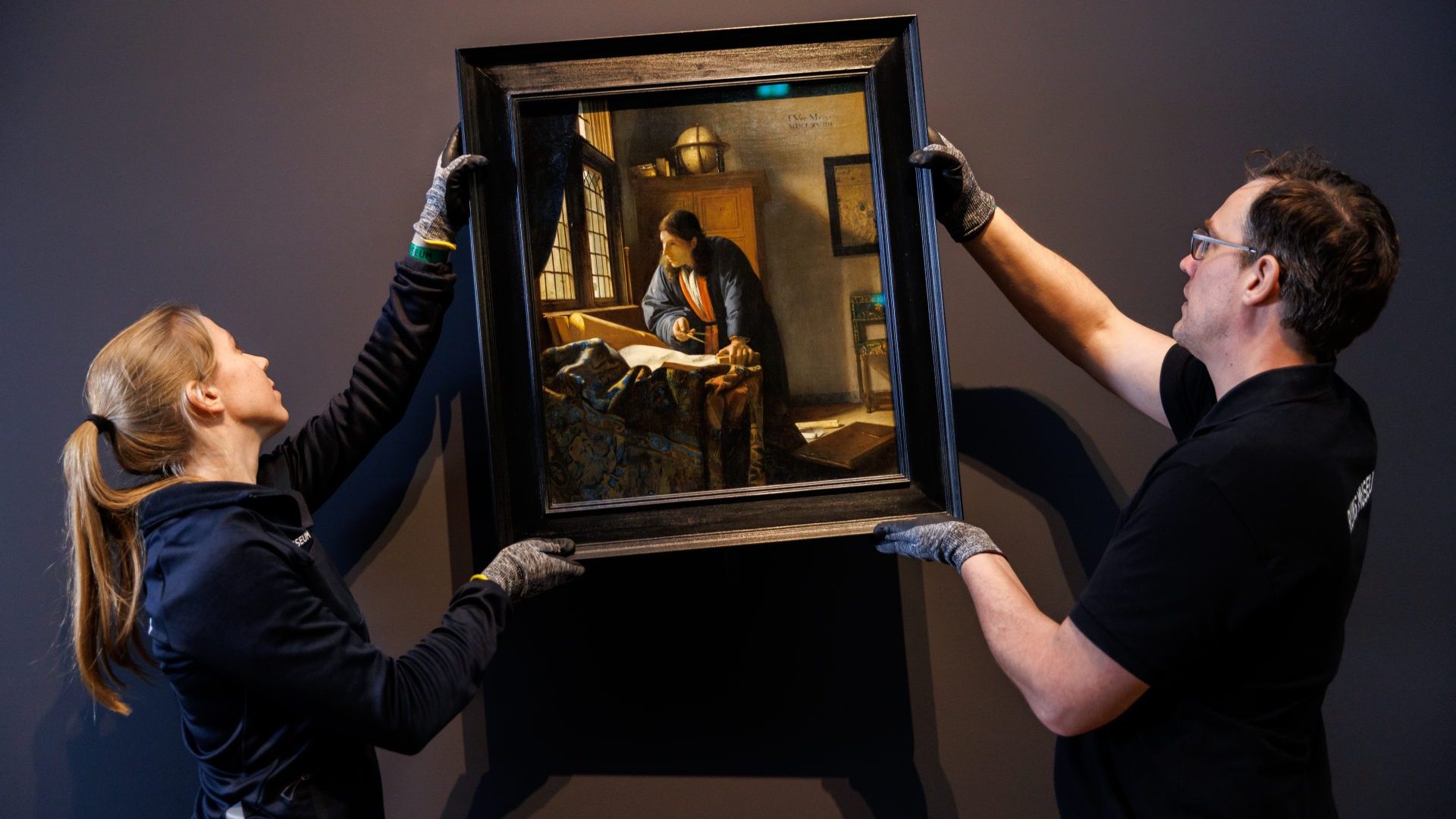 Staff at Amsterdam’s Rijksmuseum carefully install Vermeer’s The Geographer (1668-69). Photo: Rijksmuseum