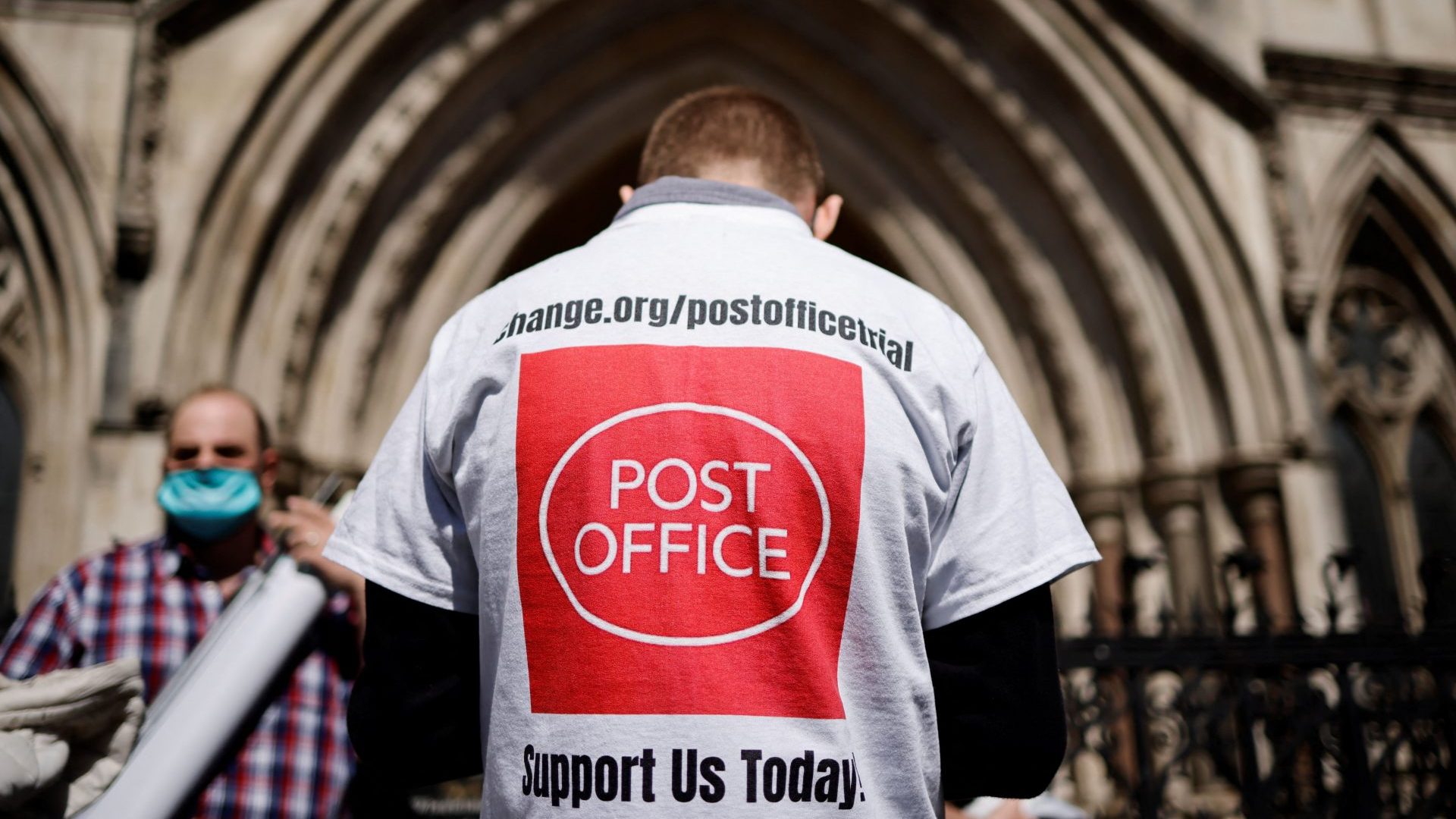 A supporter celebrates outside the Royal Courts of Justice in London, on April 23, 2021. Photo: TOLGA AKMEN/AFP via Getty Images