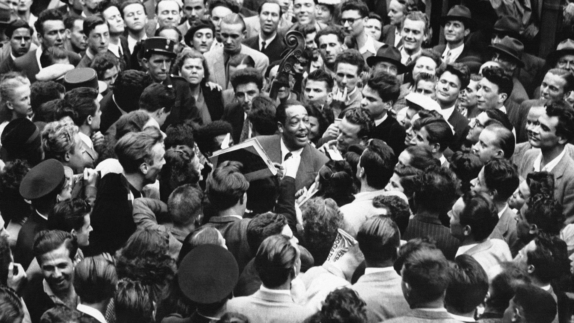 A large crowd welcomes the composer, arranger and pianist Duke Ellington on his arrival at Gare du Nord in Paris, 1948. Photo: Keystone-France/Gamma-Rapho/Getty