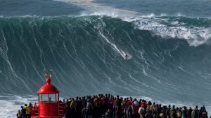 Brazilian surfer Rodrigo Koxa rides a wave 15 to 20 metres high. In the winter, waves can reach heights of 30 metres. Photo: Olivier Morin/AFP/Getty