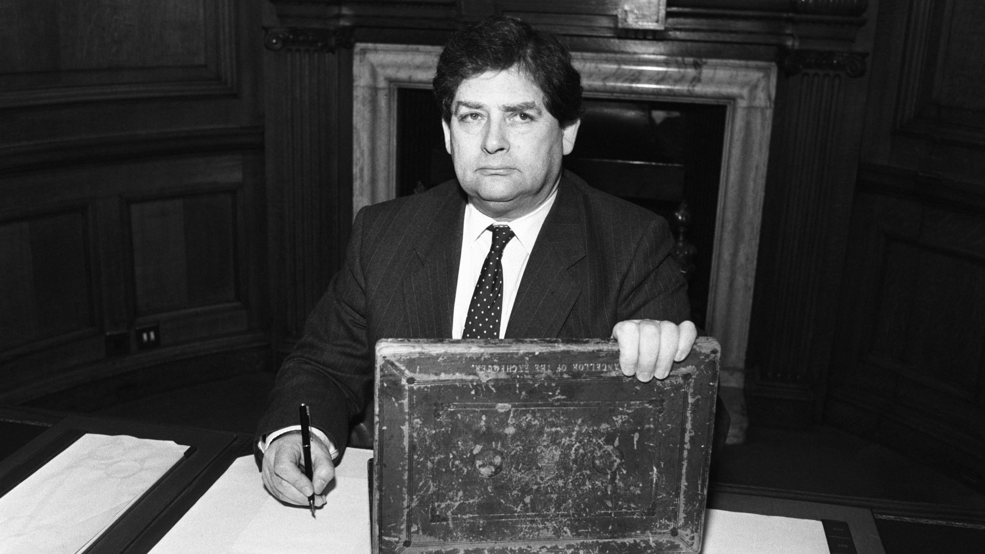 British Chancellor of the Exchequer Nigel Lawson at work with his budget box on March 08, 1989. Photo: B. Barrett/Express/Getty Images