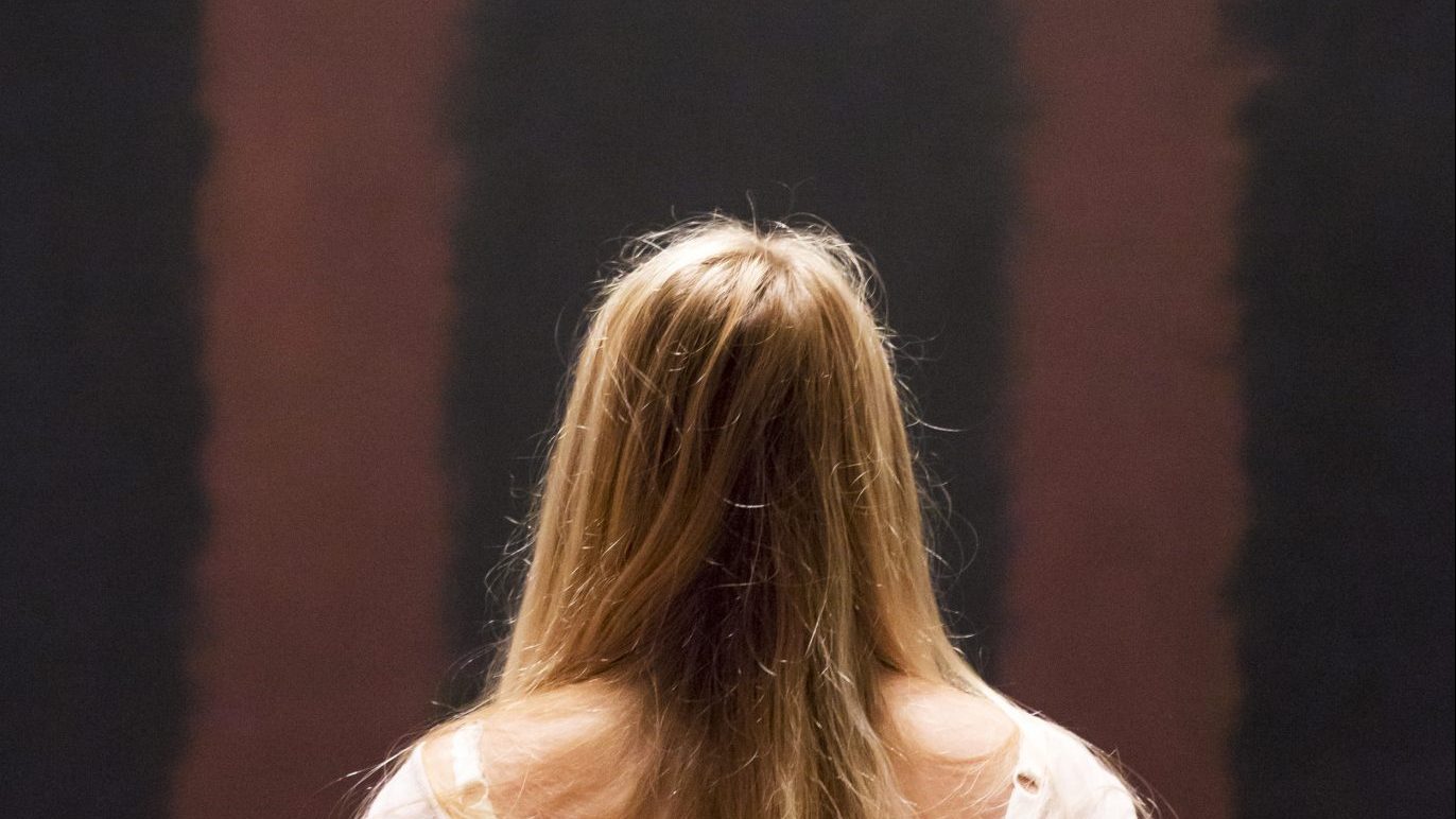 A woman looks at Mark Rothko’s Black on Maroon (1958) after going back on display at Tate Modern in 2013,
18 months after it was vandalised. Photo: Rob Stothard/Getty