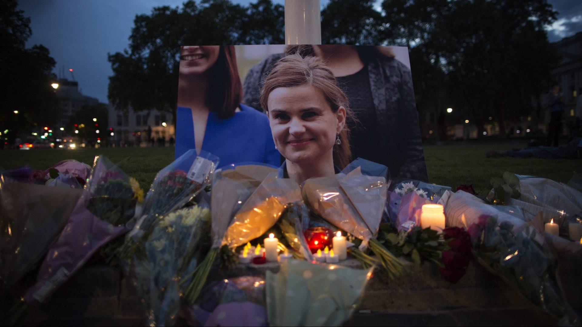  Flowers surround a picture of Jo Cox during a vigil in Parliament Square on June 16, 2016. Photo: Dan Kitwood/Getty Images