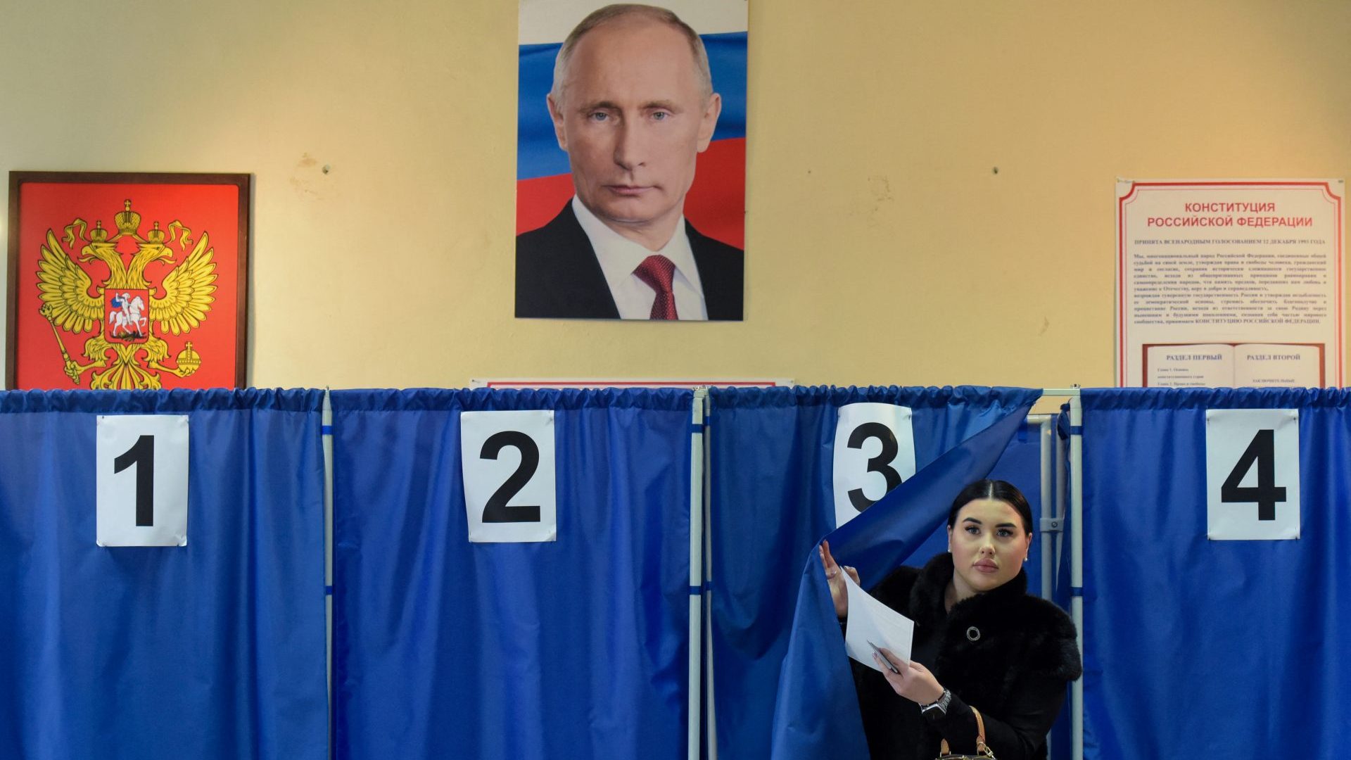 A woman votes in Russia's presidential election at a polling station in Donetsk, Russian-controlled Ukraine. Photo: STRINGER/AFP via Getty Images