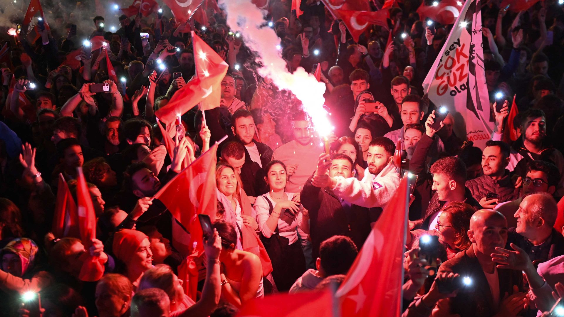 Opposition Republican People's Party (CHP) supporters celebrate outside the main municipality building. Photo: YASIN AKGUL/AFP via Getty Images