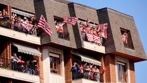 Athletic Club fans showing their support celebrate their copa del rey trophy winners tittle in the traditional trophy parade with the “Gabarra” in the Bilbao estuary. Photo: Ion Alcoba Beitia/Getty Images