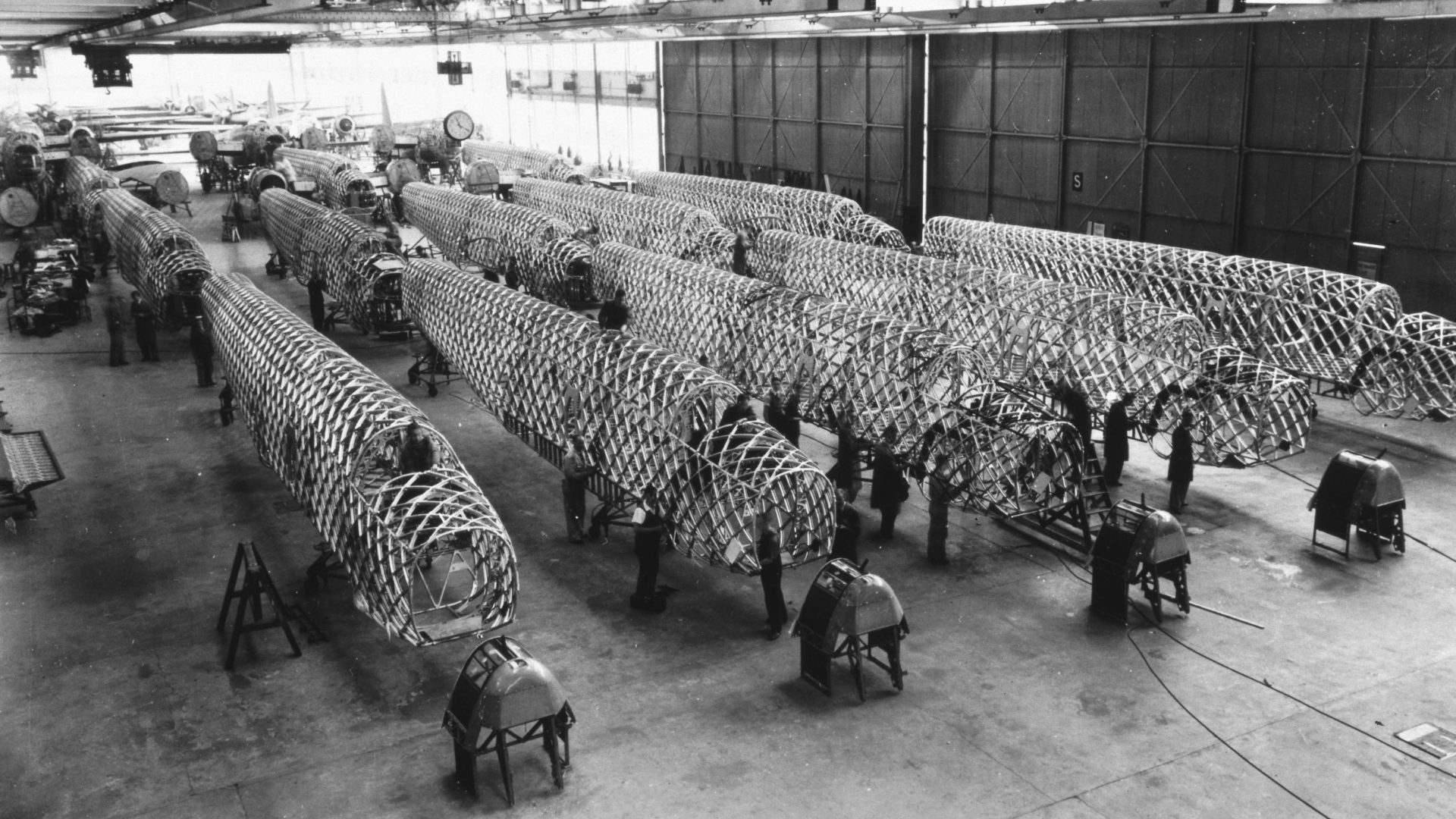 Workers assembling the fuselages of Wellington bombers at the Vickers factory at Castle Bromwich, Birmingham. Photo: SSPL/Getty Images