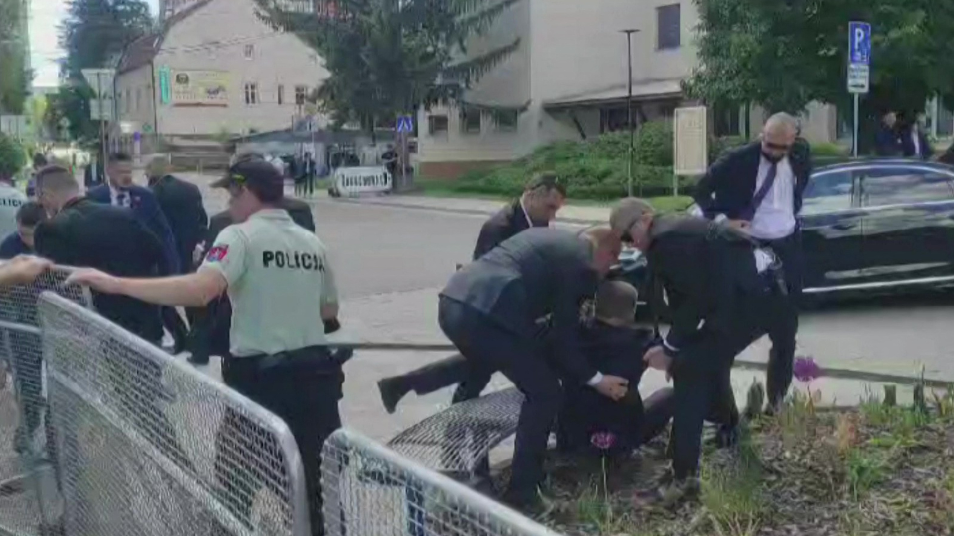 Security personnel carry Robert Fico towards a vehicle after he was shot in Handlová on May 15. Photo: RTVS/AFP/Getty