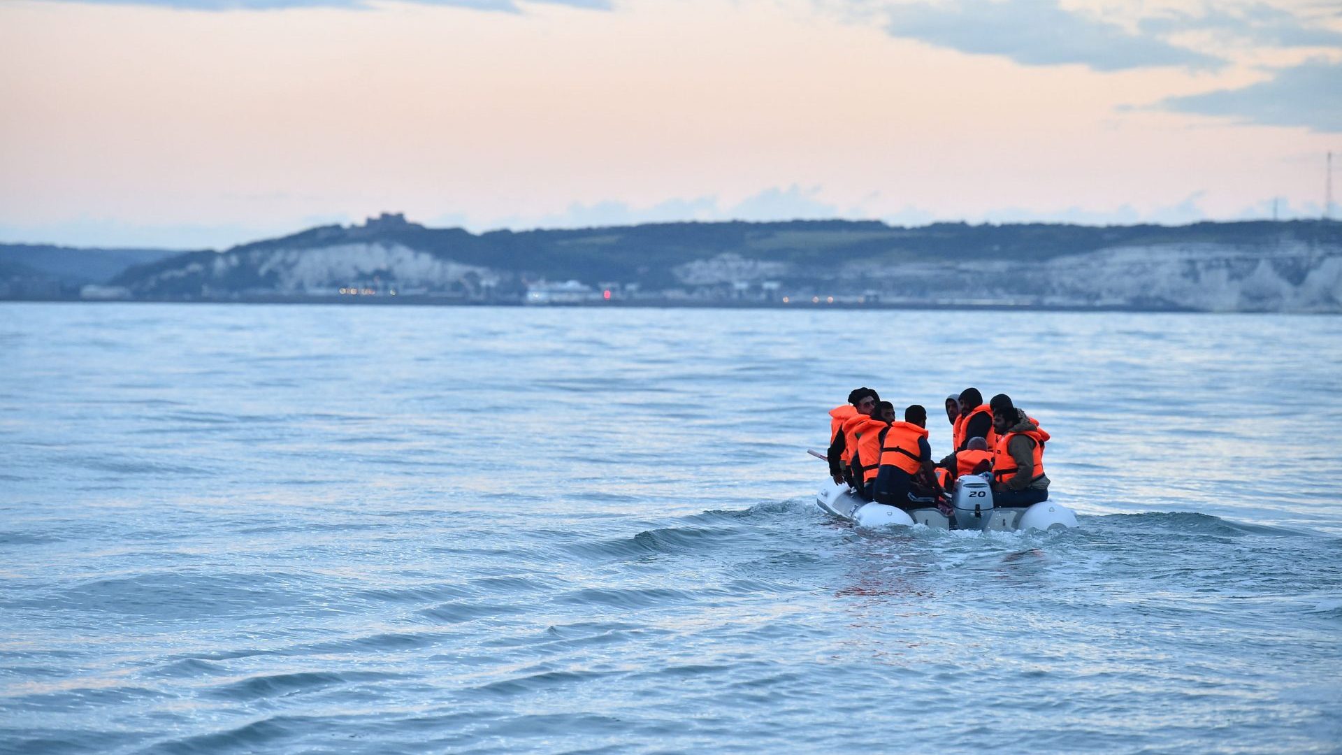 People in a dinghy head towards the south coast of England. To end the small boat crossings, Labour will need to sign a returns agreement with France. Photo: Glyn Kirk/AFP/Getty