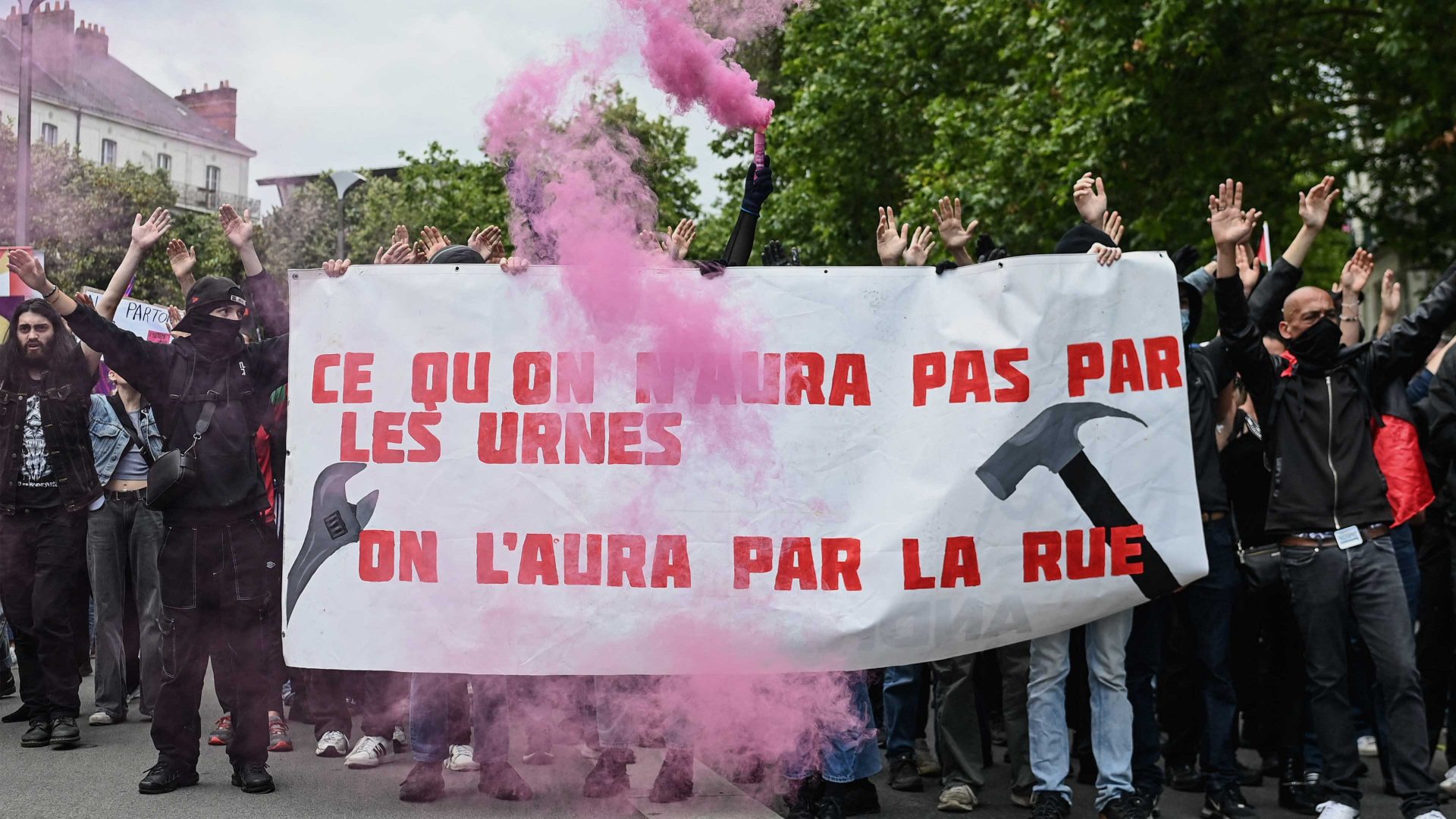 Demonstrators hold a banner reading ‘what we don’t get at the polls we get on the street’ during an anti far-right rally in Nantes. Photo: Sebastien Salom-Gomis/AFP/Getty