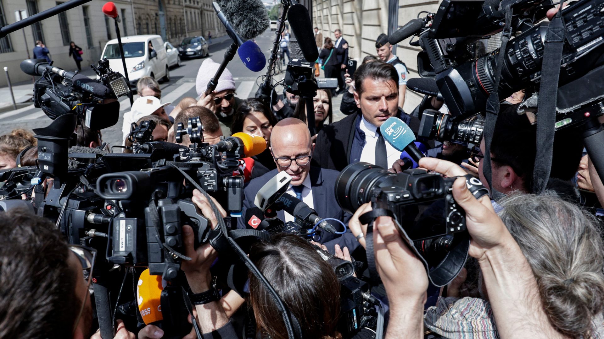 The leader of Les Républicains, Éric Ciotti (centre), addresses the media as he leaves party HQ in Paris on June 13, 2024. Photo: Stephane de Sakutin/AFP/Getty