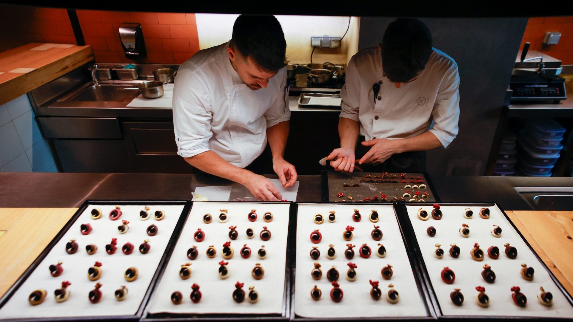 Workers at Disfrutar prepare dishes from the tasting menu. Photo: Kike Rincón/Getty