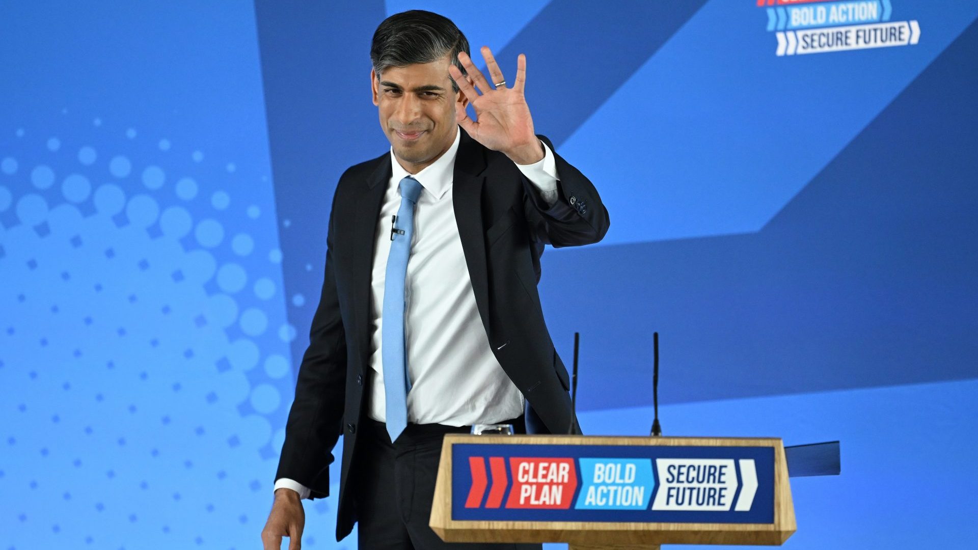 Rishi Sunak waves after speaking speaks at the Conservative Party's general election manifesto launch (Photo by Leon Neal/Getty Images)