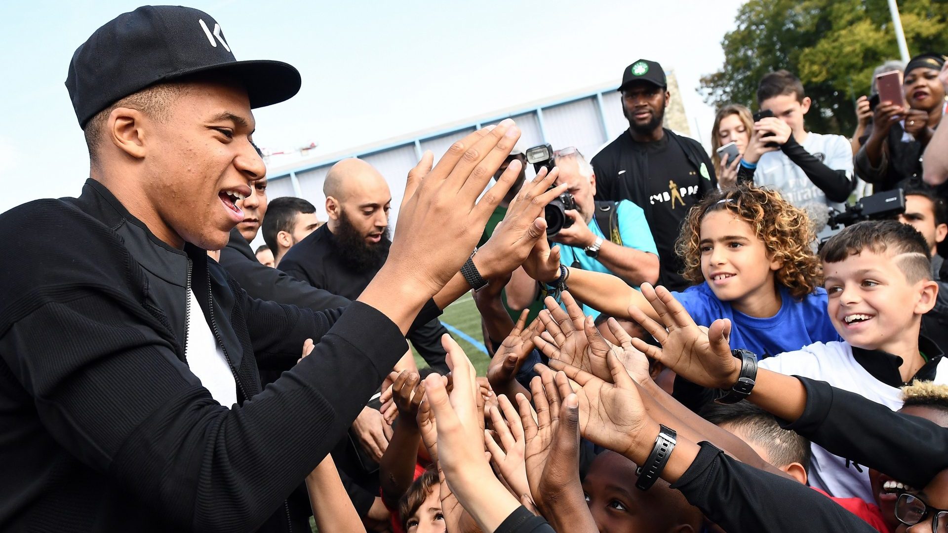 Kylian Mbappe greets fans during his first visit to the Leo Lagrange stadium in Bondy, on the outskirts of Paris. Photo: FRANCK FIFE/AFP via Getty Images