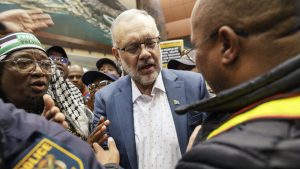 Former South African ambassador to the United States Ebrahim Rasool arrives back in Cape Town after being expelled from the US. Photo: Gianluigi Guercia/AFP/Getty

