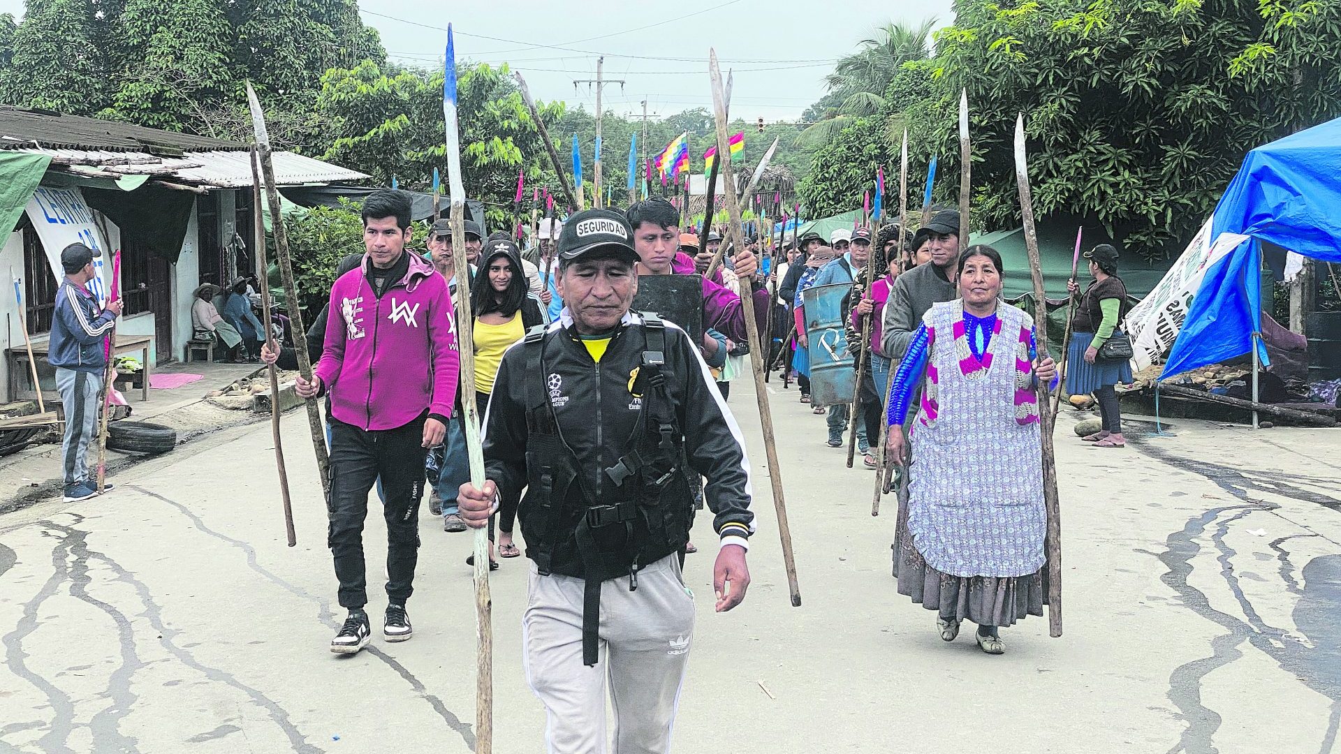 Supporters of Evo Morales parade through the streets of Lauca Ñ, where they are protecting the former president from an arrest order. Photo: Thomas Graham