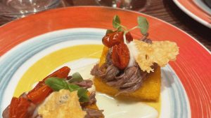 Scagliozzo: polenta topped with beef rib, cheese fondue, dried tomatoes and a parmesan crisp. Photo: Josh Barrie