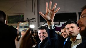Nicuşor Dan salutes his supporters as he leaves his campaign headquarters in Bucharest, May 18, 2025. Photo: Daniel Mihailescu/AFP/Getty